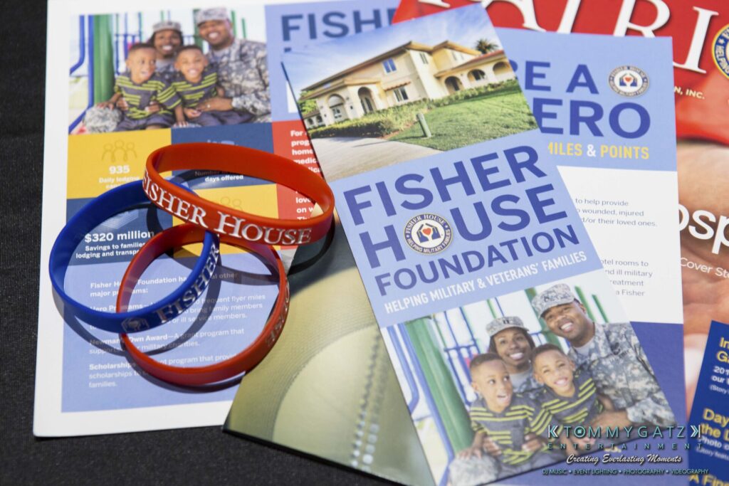 Fisher House Foundation brochures and wristbands on a table, highlighting support for military and veterans' families.