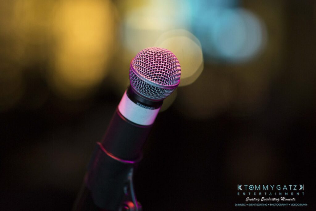 Close-up of a microphone on a stand with a blurred background.