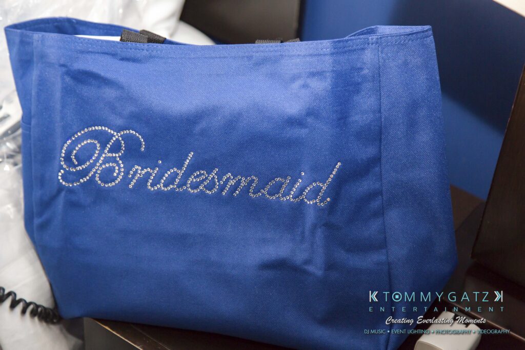 Blue tote bag with "Bridesmaid" written in rhinestones.